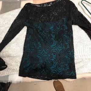 Tart black &attached turquoise blouse.